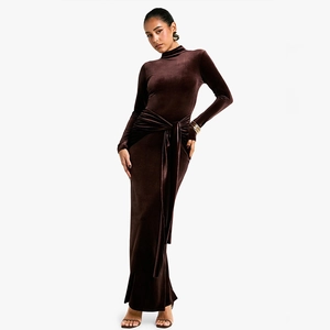 Detail of deep brown velvet dress featuring long sleeves and high neckline with side tie design