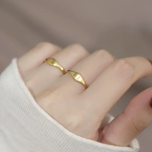 Polished 18K gold stainless steel geometric rhombus ring with minimalist style on hand