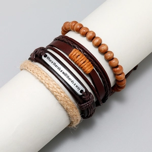 Detail of 4-piece vintage leather bracelet set with wooden beads and engraved metal plate