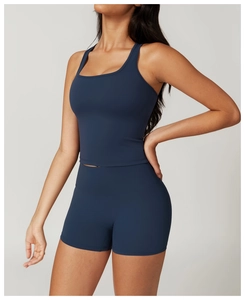 Detail of high-waist navy blue yoga shorts and high-elastic fabric in side view