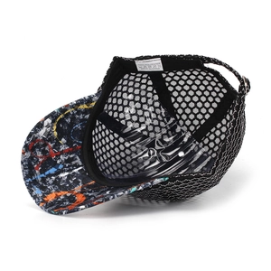 Detail of breathable hexagonal black mesh fabric and graffiti brim on baseball cap