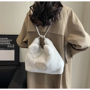 Close-up of white plush animal-shaped crossbody bag with faux leather and chain strap