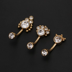 Three gold-plated curved belly rings with sparkling clear cubic zirconia crown designs