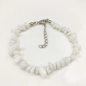 Detailed view of irregular white stone bead bracelet with silver adjustable metal clasp