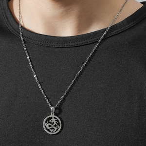 Minimalist stainless steel hollow dragon totem pendant necklace on a black shirt