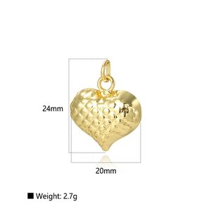 Detail view of 18k gold plated hollow heart pendant showing 24mm size and texture