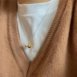 Minimalist 925 sterling silver necklace featuring gold and silver double ball pendants