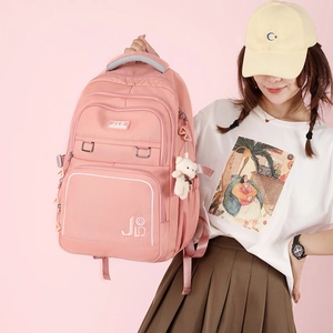 Lightweight pink waterproof backpack for school and travel with cute bear pendant