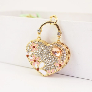 Detailed close-up of a heart-shaped keychain with crystal pavé and enamel floral accents