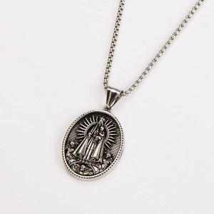 Detail of silver oval religious pendant with Virgin Mary portrait on box chain