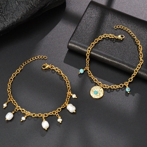 Gold-plated stainless steel bracelet set with baroque pearls and turquoise evil eye pendant
