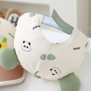 Close-up of adjustable velcro strap and panda ear detail on a kids cotton baseball cap