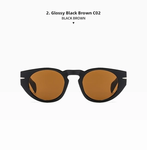 Macro detail of glossy black frames and brown lenses for retro oval sunglasses