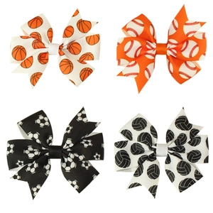 Set of four handmade ribbon hair clips with basketball, baseball, soccer and volleyball prints