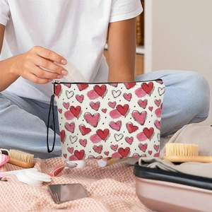 Women's heart print toiletry bag with zipper and wristlet strap for travel storage