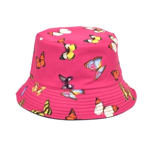 Detail of fuchsia reversible bucket hat with vibrant colorful butterfly print and stitching