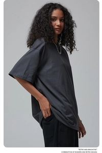 Close-up of deep charcoal grey oversized cotton t-shirt fabric texture and quality