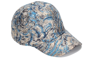 Close-up of the metallic gold and blue jacquard texture on this fashion baseball cap