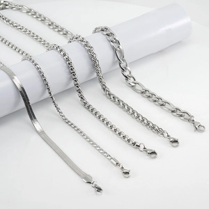 Close-up of five silver titanium steel hip-hop chains with lobster clasps for jewelry making