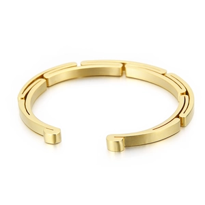 Minimalist gold stainless steel cuff bracelet with a modular geometric拼接 design