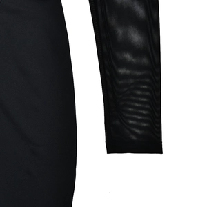 Detail of long sleeve bodysuit featuring transparent black mesh and solid fabric textures