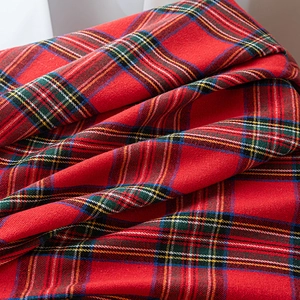 Classic red plaid Christmas curtain fabric with festive snowflake pompoms for living room decor
