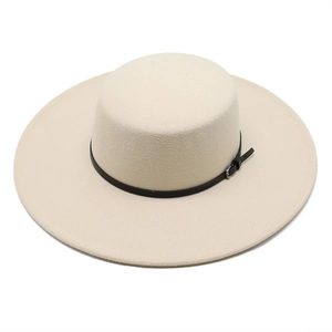 Detail of cream flat top wool felt hat featuring a thin black leather band and metal buckle