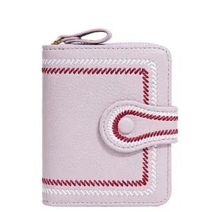 Short lavender faux leather wallet for women with pebbled texture and metal zipper