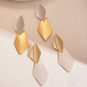 Modern geometric rhombus drop earrings featuring brushed and mirrored metal finishes