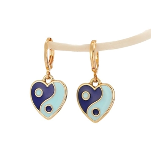 Golden heart-shaped yin yang earrings with blue enamel finish on decorative branch
