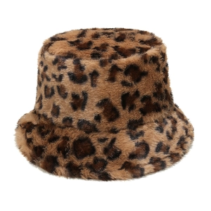 Close-up of thick faux fur leopard print bucket hat with soft texture and warm winter material