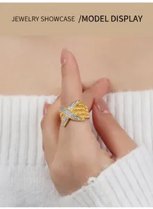 Detailed macro of gold honeycomb texture ring with silver diamond-set X-pattern