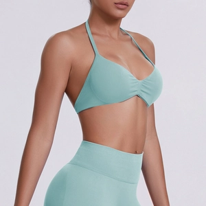 Detail view of seamless mint green halter yoga bra and high waist leggings set