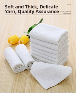 Detail of high-density cotton hotel towels with thick pile texture on wooden background