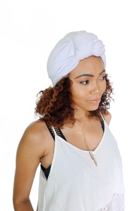 Detail of a white twisted knot turban hat with soft elastic fabric and stylish knot design
