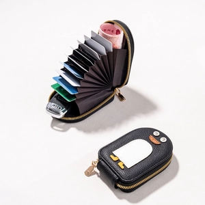 Cute penguin leather card holder with accordion slots and gold zipper in black
