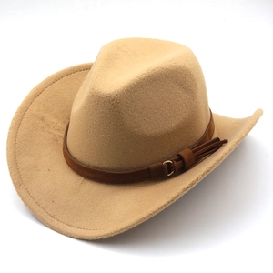 Detail of camel wool fedora hat featuring a brown suede band with metal ring and tassel