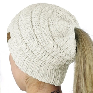 Women's cream white cable knit ponytail beanie with open top and leather logo detail