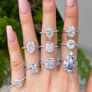 Elegant S925 sterling silver rings with various gemstone cuts on a hand