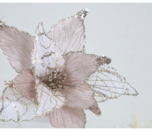 Close-up of champagne gold artificial Christmas flower with sequins and mesh petals