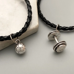 Men's black braided leather bracelet with silver metal dumbbell and football charms