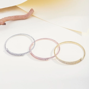 Detailed view of triple-color layered bracelets with micro-pave cubic zirconia crystals
