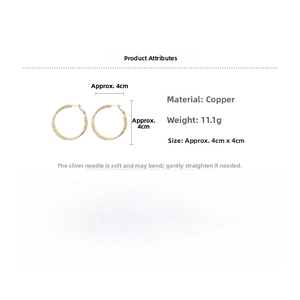 Detail view of 4cm gold hoop earrings with silver needles showing size and 11.1g weight