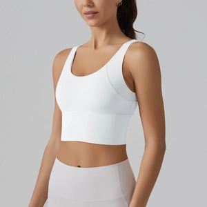Side view of white seamless sports bra showing high-elasticity fabric and wide hem