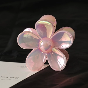 Detail of pink pearlescent flower hair claw clip with glossy polarized finish