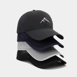 Close-up of laser-cut mesh holes on breathable quick-dry sports baseball caps in four colors