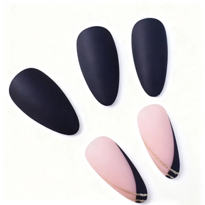Matte black and pink stiletto false nails with glitter lines on white background
