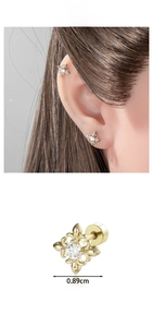 Detail of iris cross ear stud in coffee gold with 0.89cm fleur-de-lis design