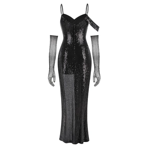 Detail of black sequined backless dress and matching mesh sequin gloves on white backdrop