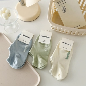 Three pairs of breathable combed cotton ankle socks in pastel blue, green, and cream white